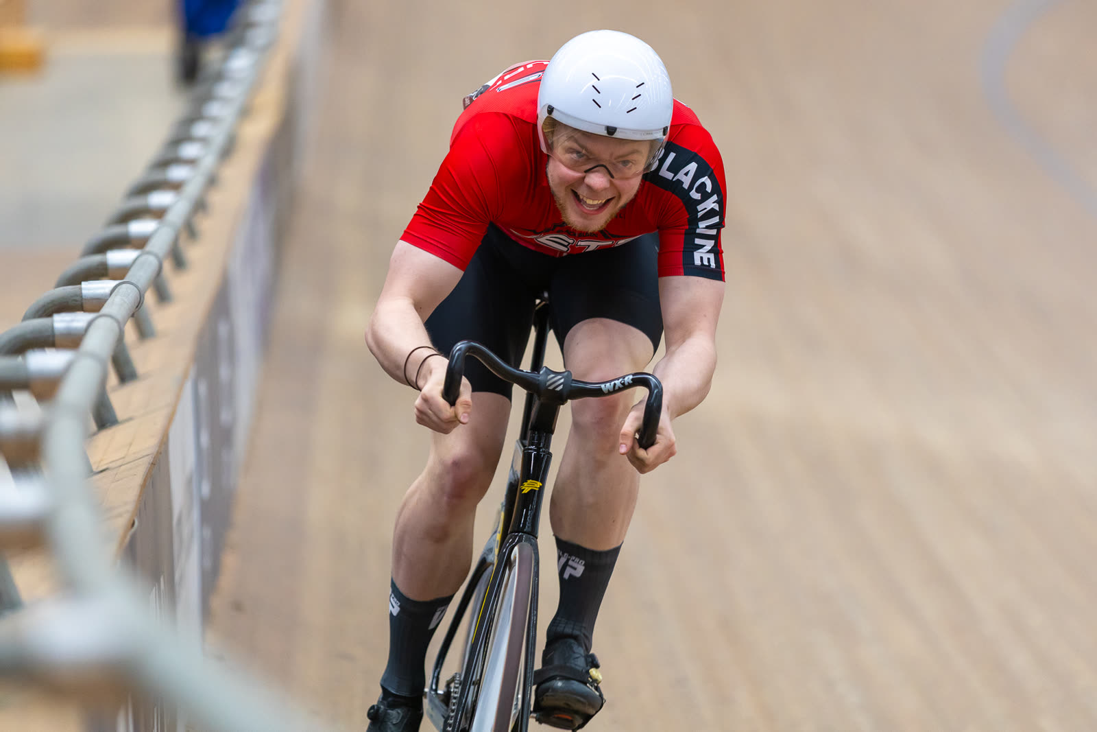 Rider racing in red Blackline jersey