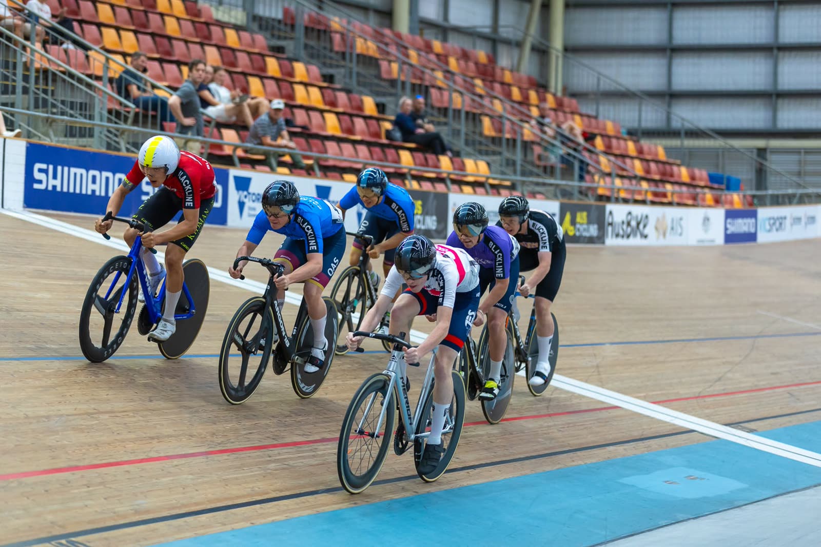 Group of riders racing at the velodrome